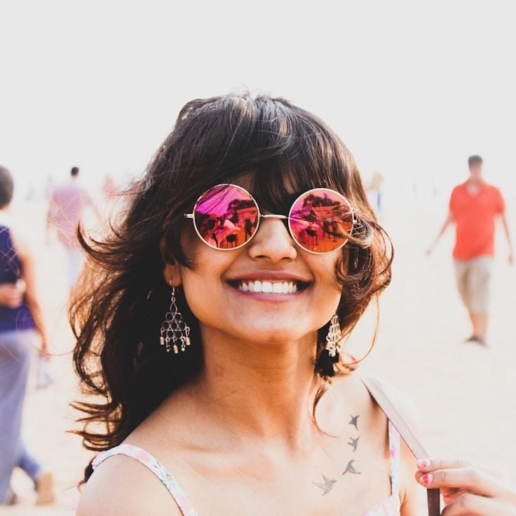 Avery Chen, Lead Design Curator at Solar Axis Pivot, reviewing corporate floral arrangements